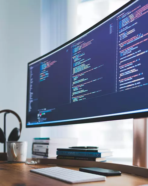 Computer with code on screen